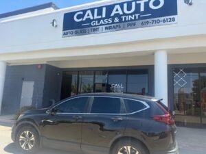 Honda CR-V with tinted windows outside the Cali Auto Glass and Tint storefront in El Cajon
